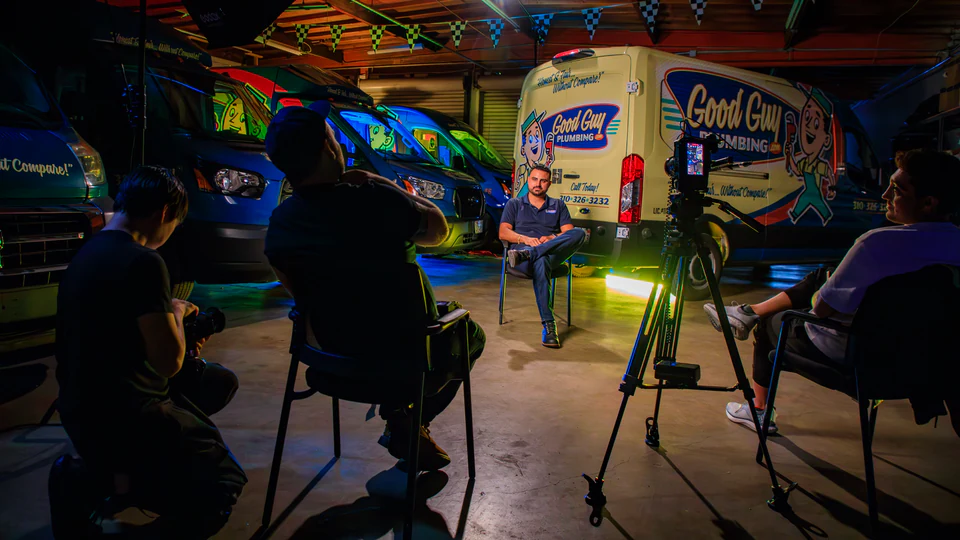 Our crew filming an interview with a plumbing company owner